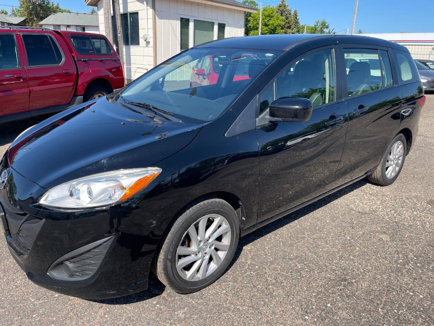 2012 BLACK /BLACK Mazda MAZDA5 Sport (JM1CW2BLXC0) with an 2.5L L4 DOHC 16V engine, AUTOMATIC transmission, located at 434 West Main Street, Anoka, MN, 55303, (763) 576-9696, 45.201759, -93.396706 - MULTI-POINT "PERFORMANCE" INSPECTION PERFORMED: Transmission/clutch, Engine performance, Brakes, Steering, Heater/Air Conditioning, Instruments/Controls, Headlights/fog lights, Brake/back-up lights, Interior/warning lights, Turn signals/flashers MULTI-POINT "UNDER HOOD" INSPECTION PERFORMED : F - Photo#0