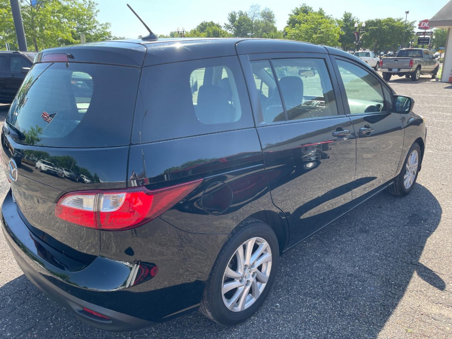2012 BLACK /BLACK Mazda MAZDA5 Sport (JM1CW2BLXC0) with an 2.5L L4 DOHC 16V engine, AUTOMATIC transmission, located at 434 West Main Street, Anoka, MN, 55303, (763) 576-9696, 45.201759, -93.396706 - MULTI-POINT "PERFORMANCE" INSPECTION PERFORMED: Transmission/clutch, Engine performance, Brakes, Steering, Heater/Air Conditioning, Instruments/Controls, Headlights/fog lights, Brake/back-up lights, Interior/warning lights, Turn signals/flashers MULTI-POINT "UNDER HOOD" INSPECTION PERFORMED : F - Photo#4