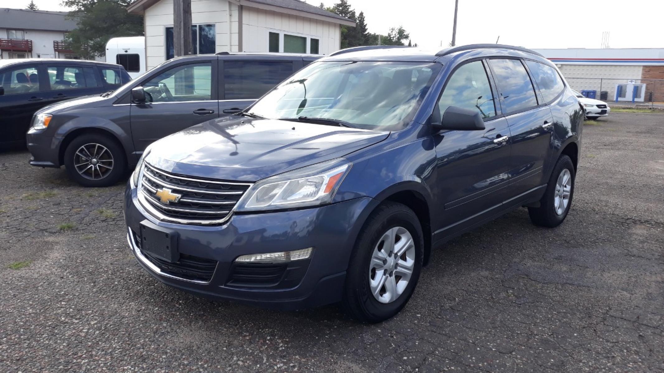 2014 Electronic Blue /GRAY Chevrolet Traverse LS FWD w/PDC (1GNKRFEDXEJ) with an 3.6L V6 DOHC 24V engine, 6-Speed Automatic transmission, located at 434 West Main Street, Anoka, MN, 55303, (763) 576-9696, 45.201759, -93.396706 - 3RD ROW SEAT!! 4 OWNER / NO ACCIDENTS MULTI-POINT "PERFORMANCE" INSPECTION PERFORMED: Transmission/clutch, Engine performance, Brakes, Steering, Heater/Air Conditioning, Instruments/Controls, Headlights/fog lights, Brake/back-up lights, Interior/warning lights, Turn signals/flashers MULTI-PO - Photo #0