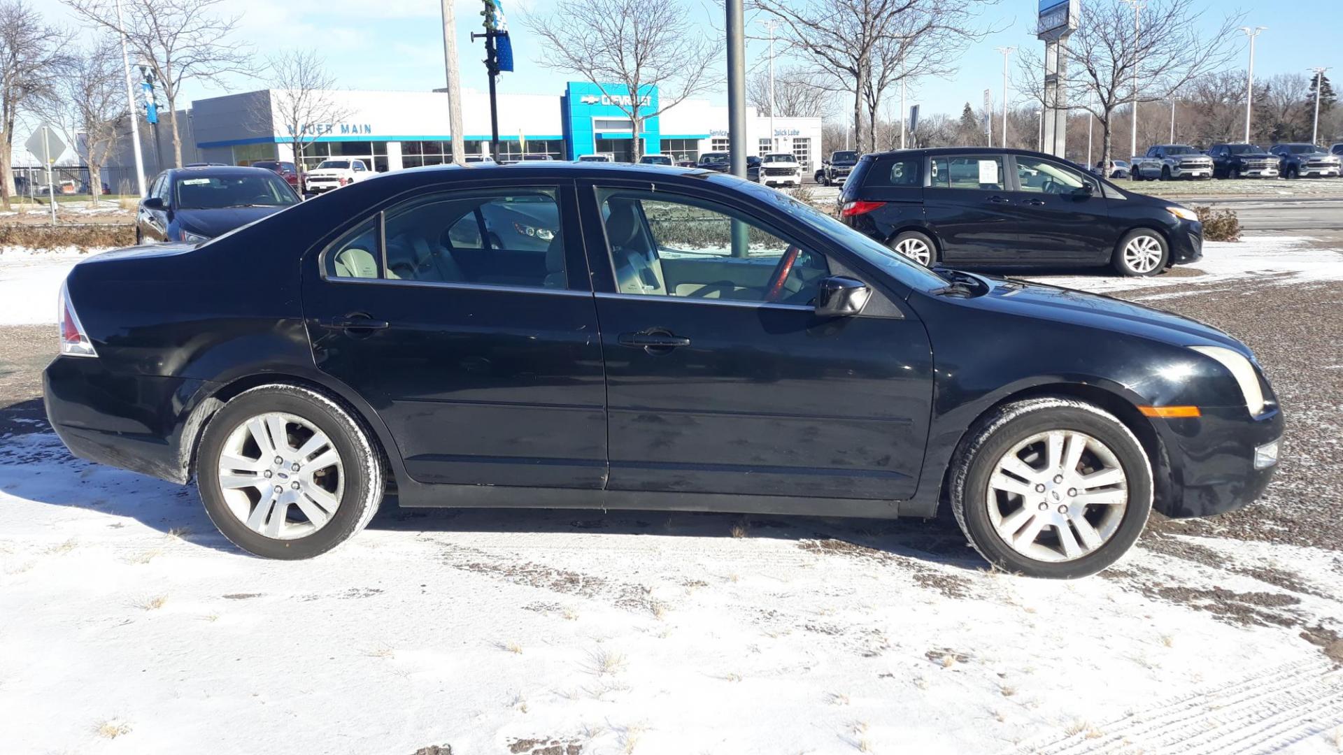 2006 BLACK /GRAY Ford Fusion V6 SEL (3FAHP08126R) with an 3.0L V6 DOHC 24V engine, 6-Speed Automatic Overdrive transmission, located at 434 West Main Street, Anoka, MN, 55303, (763) 576-9696, 45.201759, -93.396706 - 2006 FORD FUSION SEL , CHEAP TRANSPORTATION, LOOKS GOOD AND RUNS GOOD. - Photo#1