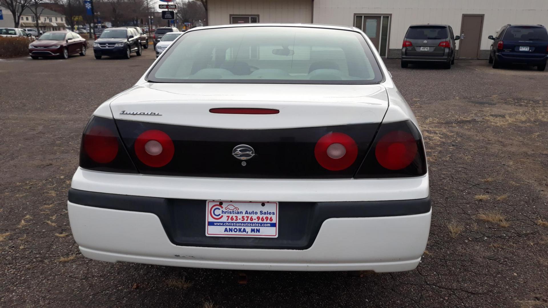 2005 WHITE /GRAY Chevrolet Impala Base (2G1WF52E759) with an 3.4L V6 OHV 12V engine, 4-Speed Automatic Overdrive transmission, located at 434 West Main Street, Anoka, MN, 55303, (763) 576-9696, 45.201759, -93.396706 - 2005 CHEVROLET IMPALA, Air Conditioning; Power Windows; Power Locks; Power Steering; Tilt Wheel; AM/FM Cassette; AM/FM CD; Pass Key Security; Daytime Running Lights; Dual Front Air Bag; Active Belts; All Wheel ABS - Photo#5