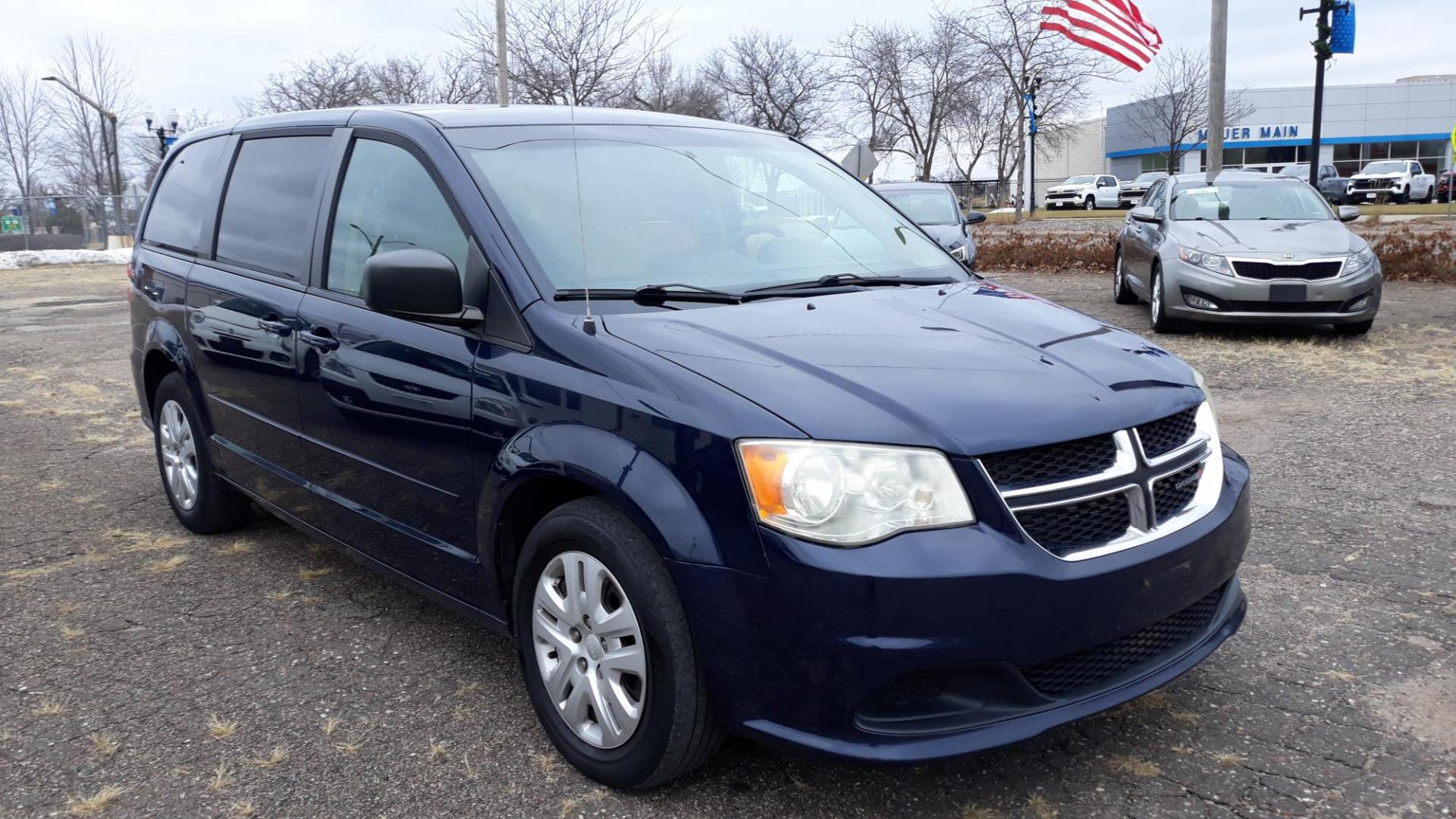 2014 Blue /TAN Dodge Grand Caravan SE (2C4RDGBG5ER) with an 3.6L V6 DOHC 24V engine, 6-Speed Automatic transmission, located at 434 West Main Street, Anoka, MN, 55303, (763) 576-9696, 45.201759, -93.396706 - Photo#1